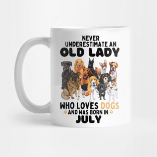 Never Underestimate An Old Lady Who Loves Dogs And Was Born In July Mug